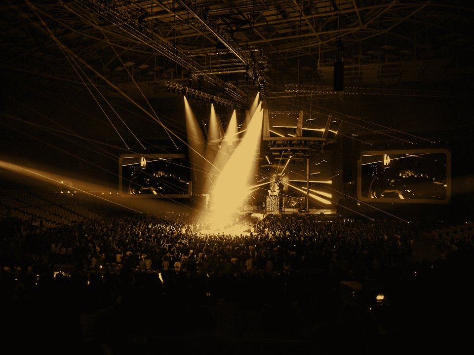 Concert crowd under stage lighting